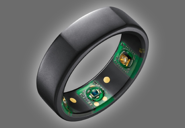 Close-up of a black Oura Ring showing internal sensors used for sleep tracking and health monitoring.